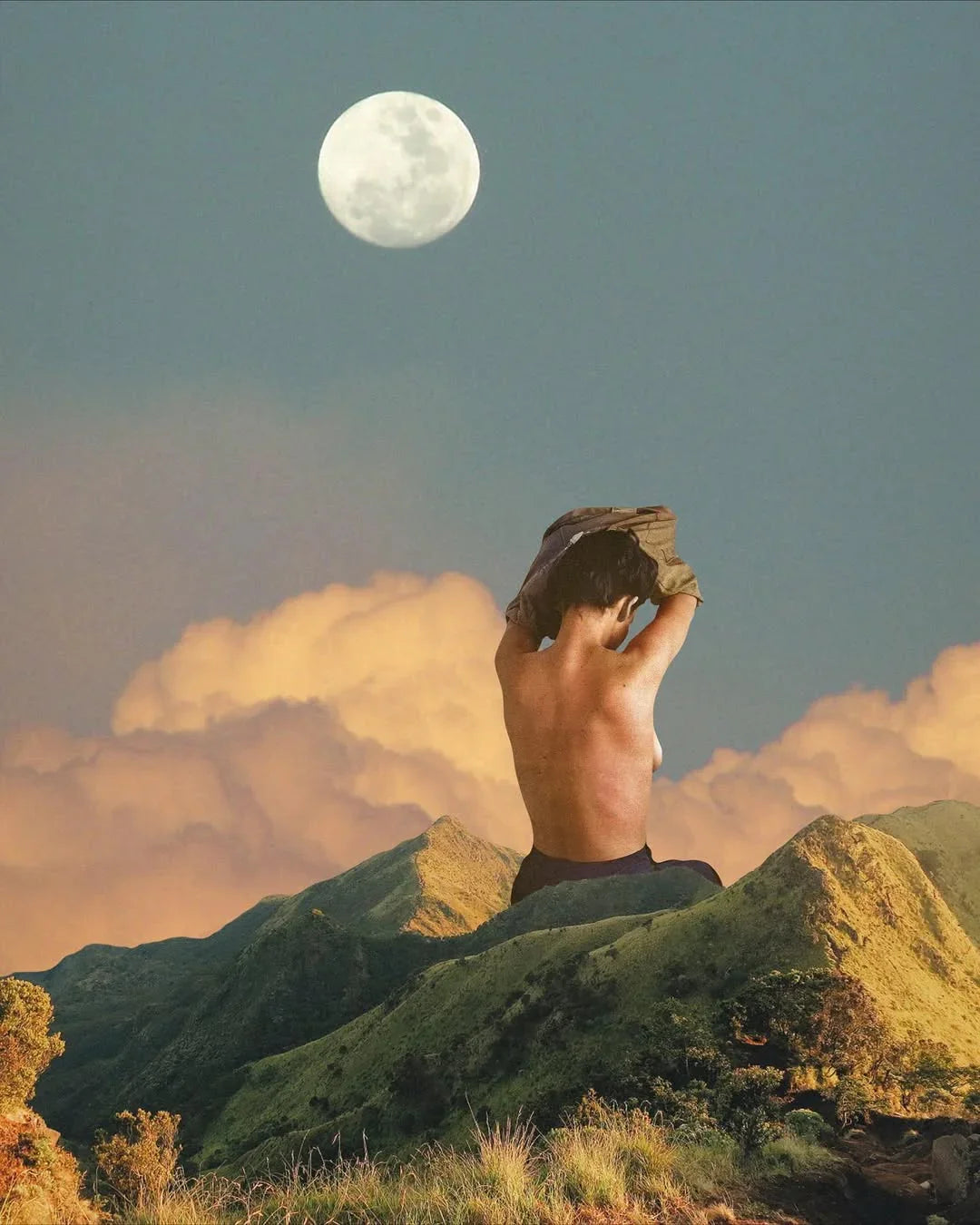 Bare-backed person on sunlit green hills beneath a glowing full moon and soft amber clouds.