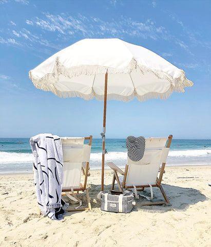 Embrace Summer Vibes: White Beach Chairs and Colorful Accessories for a Stylish Seaside Retreat - Wylde Grey