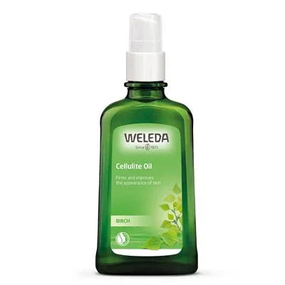 Green glass bottle of Weleda Birch Cellulite Oil with pump dispenser and leaf design
