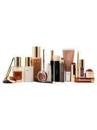 MERIT Beauty full collection of makeup and skincare products with gold accents on bottles and tubes