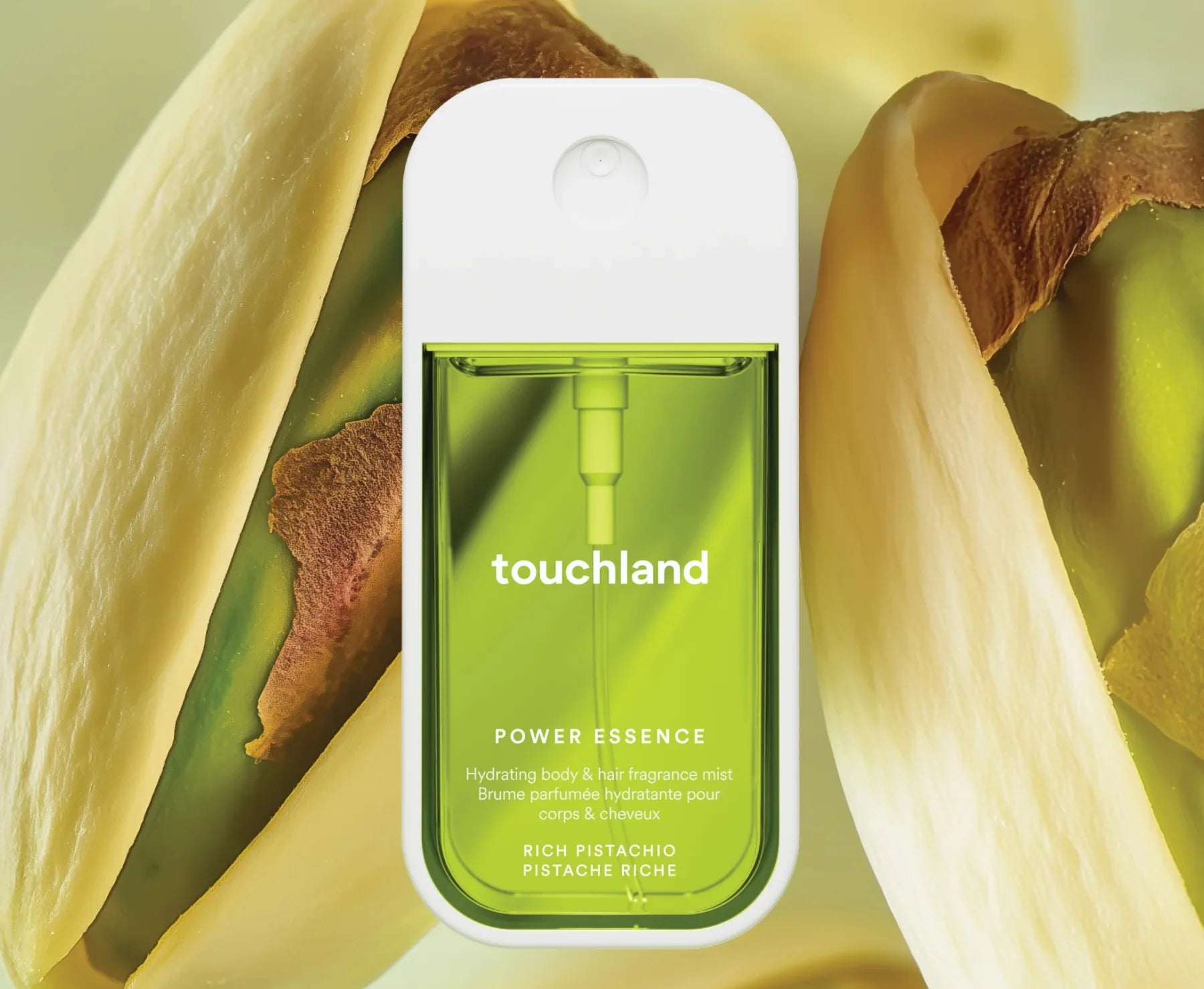 Touchland Rich Pistachio Power Essence bottle with pistachio background
