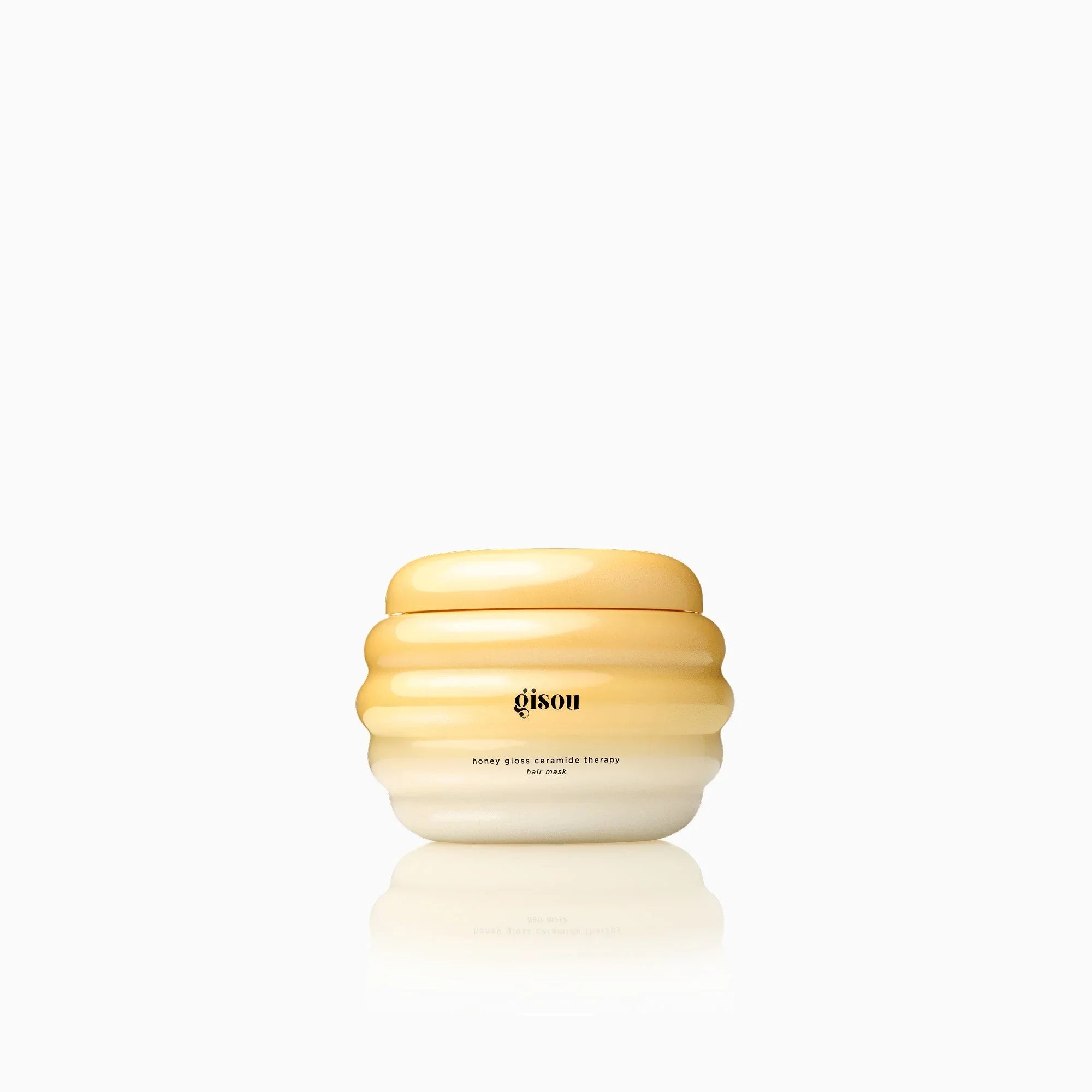 Gisou honey gloss ceramide therapy hair mask in a glossy yellow ombre jar on a white background
