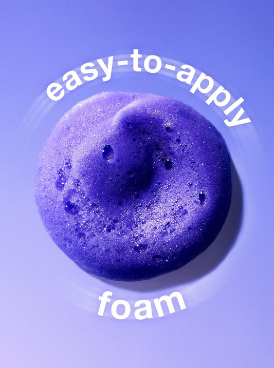 Luxurious vibrant violet foam texture on a sleek purple background, easy-to-apply skincare.