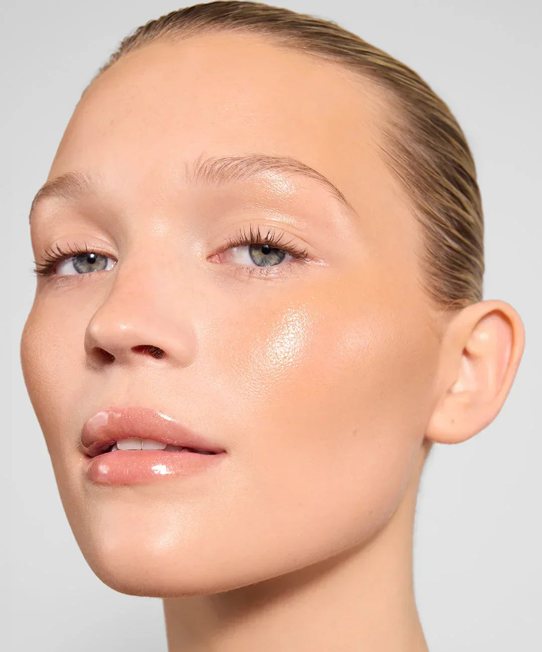 | desc: Jemima wears Lip Gloss in shade Topaz