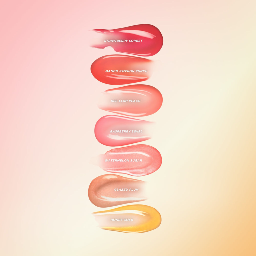 Seven different Gisou lip oil swatches.