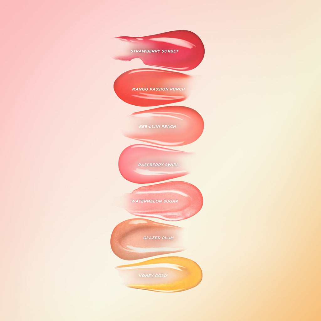 Seven different lip oil swatches from darkest to lightest.