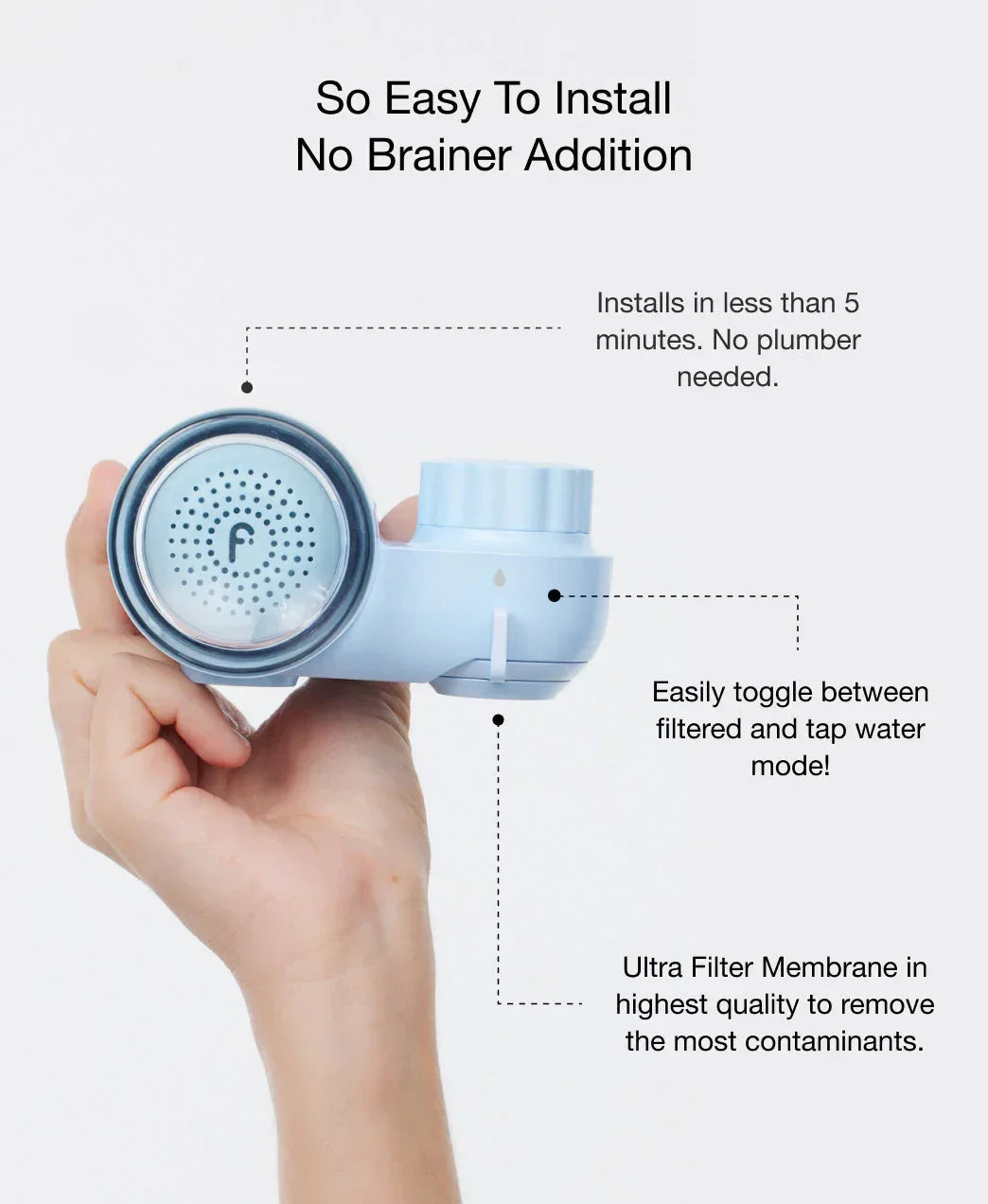 Hand holding sleek blue water filter with silver mesh, luxury minimalist design, Wylde Grey