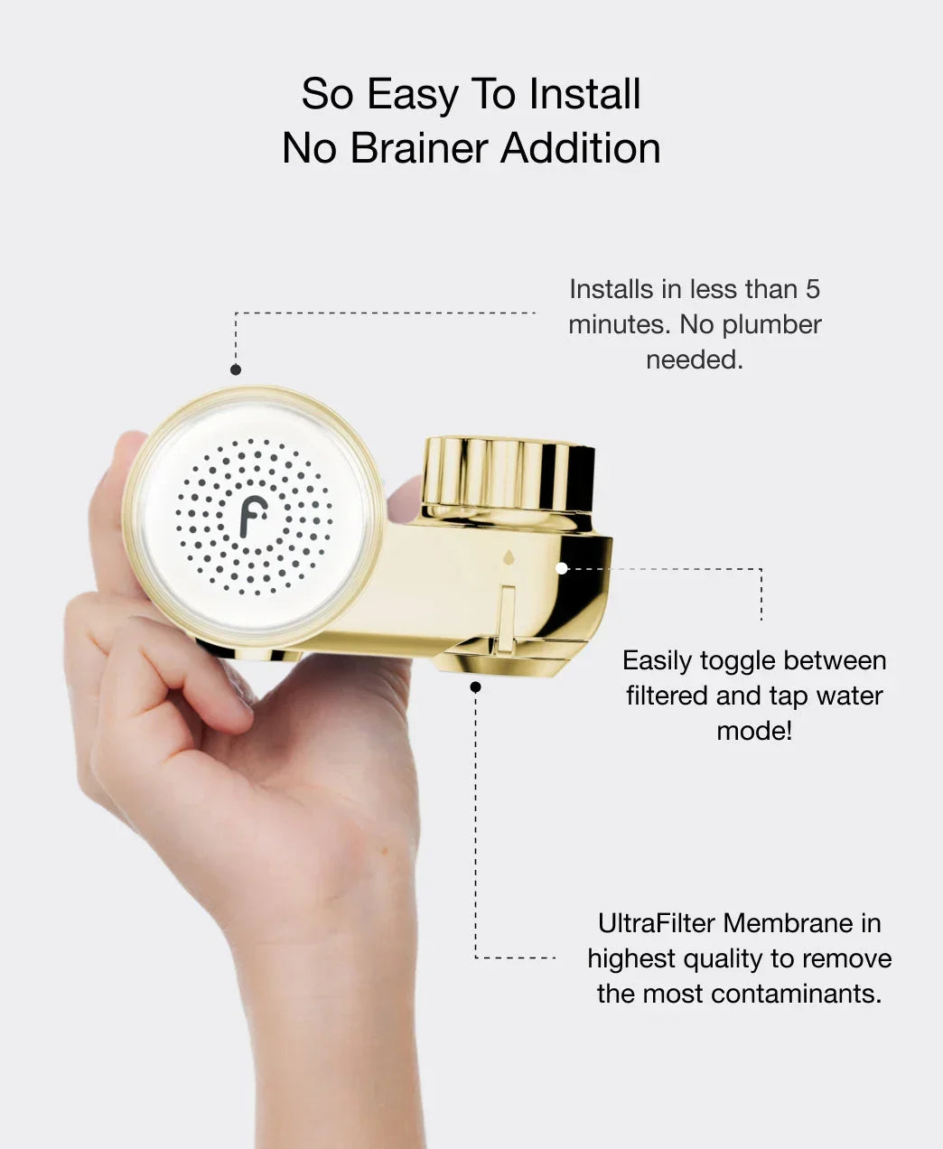 Hand holding a gold faucet water filter with a sleek, shiny finish, showing easy installation and luxury design.