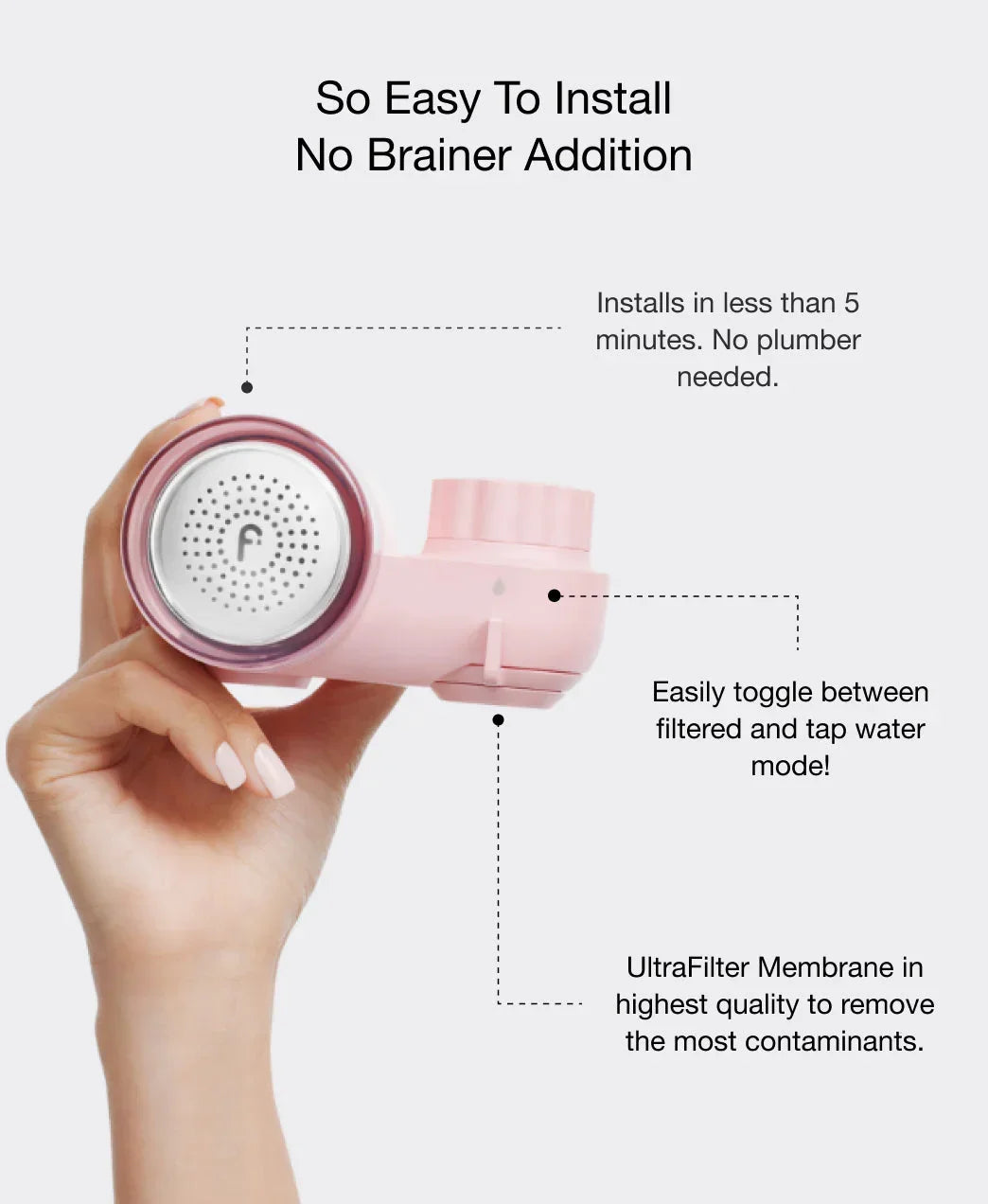 Elegant hand holding a pink water filter with silver details, easy install, Wylde Grey beauty essentials