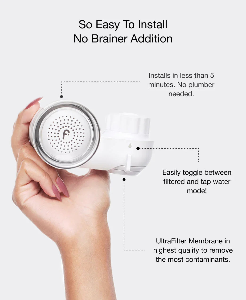 Hand holding sleek white water filter attachment with silver accents, easy install and toggle feature.