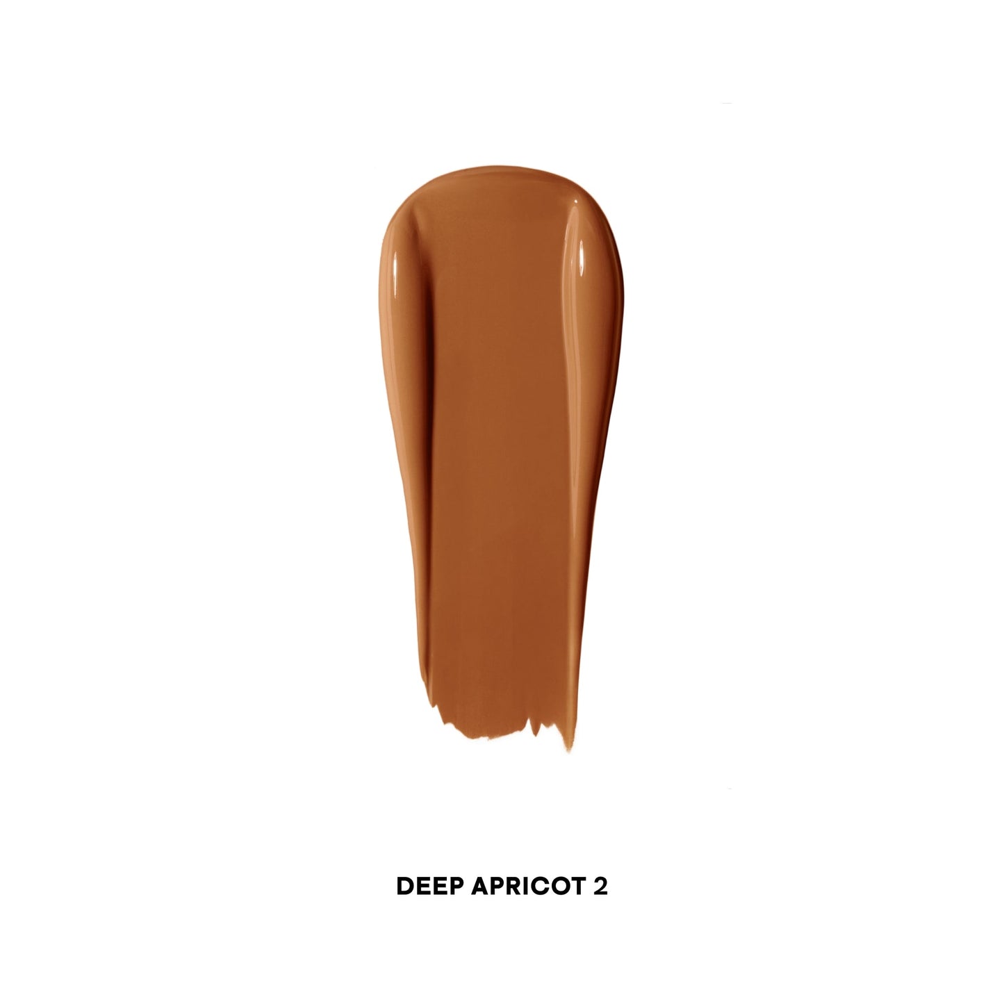 Creamy deep apricot concealer swatch with a smooth, luminous finish on white background.