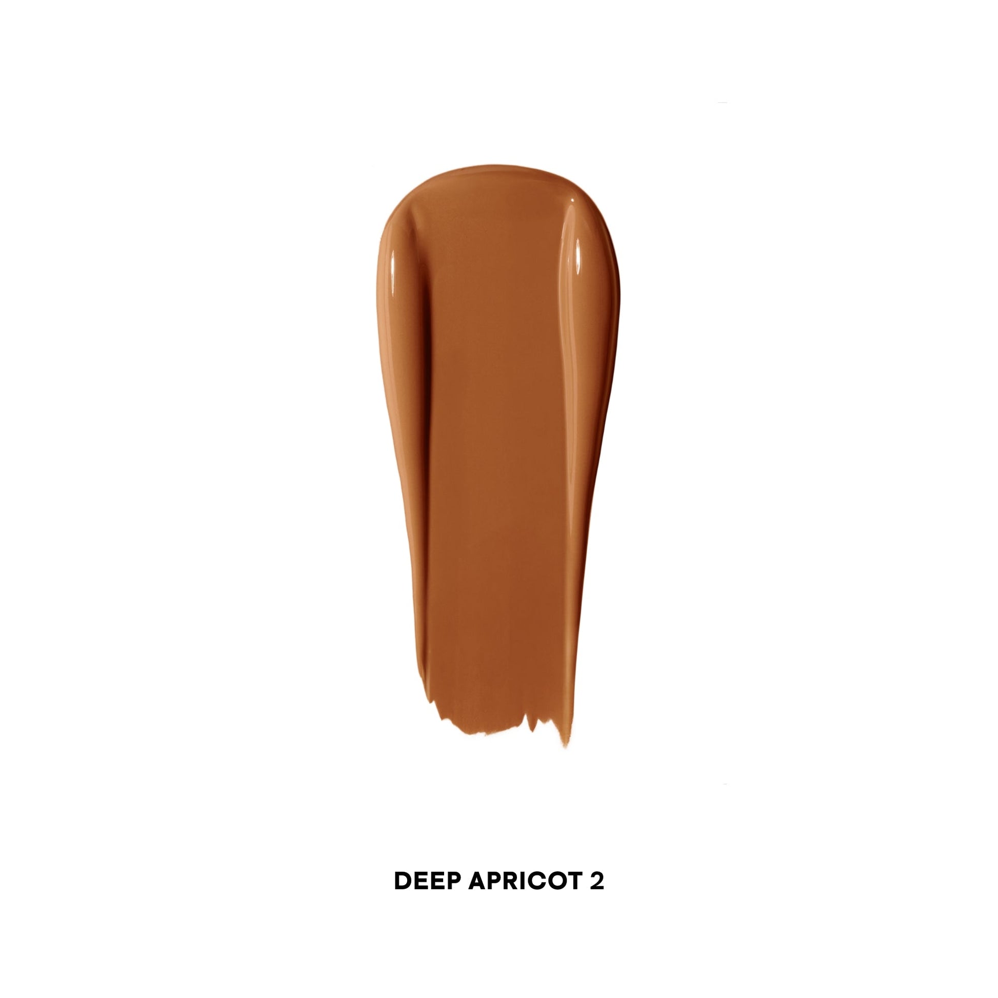 Creamy deep apricot concealer swatch with a smooth, luminous finish on white background.