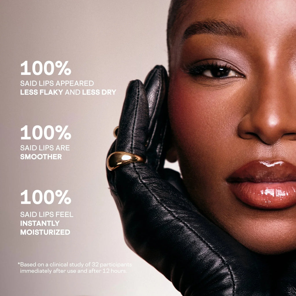 Model with dewy, glossy lips and smooth skin, wearing black leather glove and gold ring, luxury skincare promo