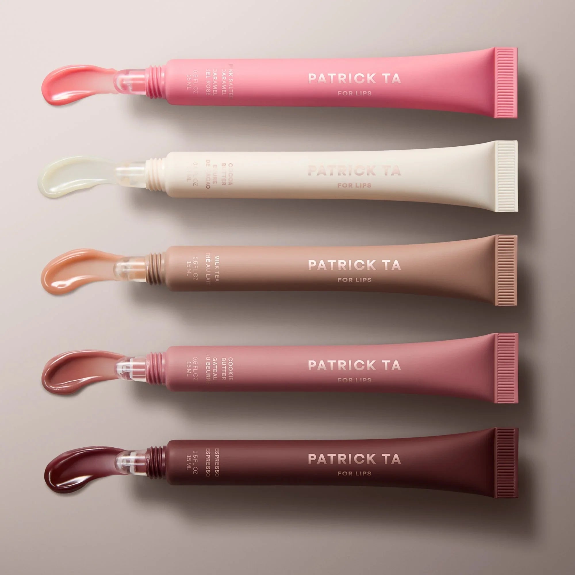 Patrick Ta lip gloss tubes in pink, nude, rose, and berry shades with glossy finish