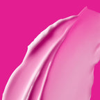 A smooth, pink skincare product swatch with a creamy texture.