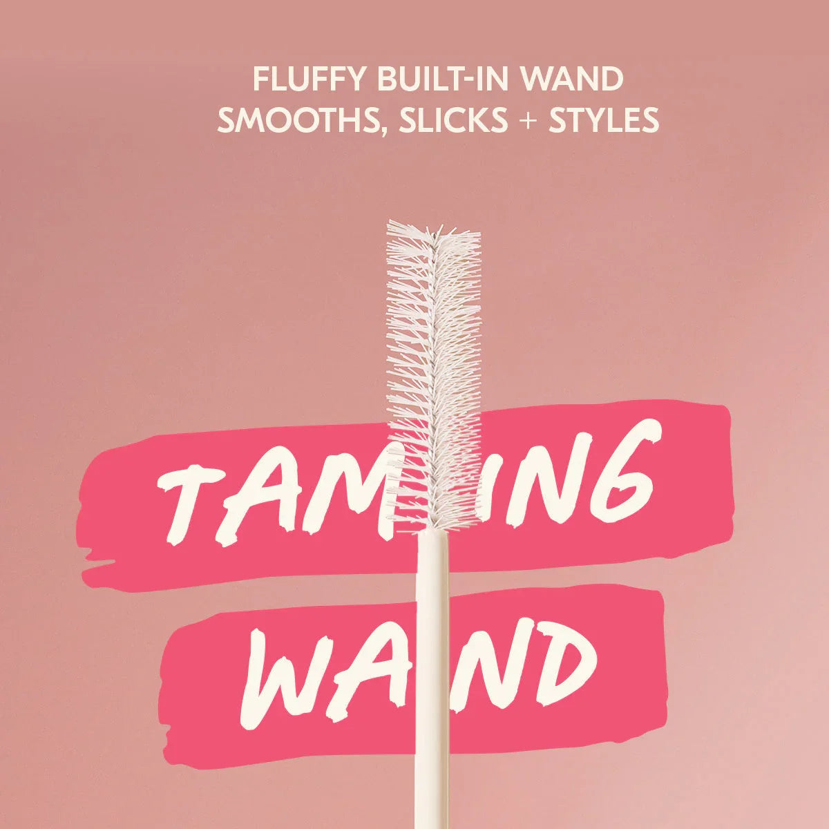 Fluffy built-in taming wand for styling hair, featured on a pink background at Wylde Grey.