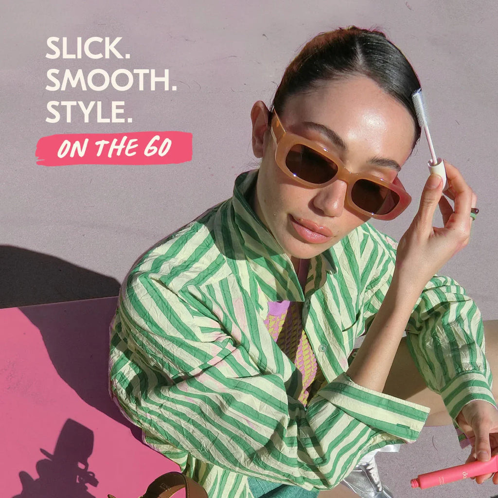 Woman in sunglasses and striped shirt using beauty wand, Wylde Grey viral beauty style