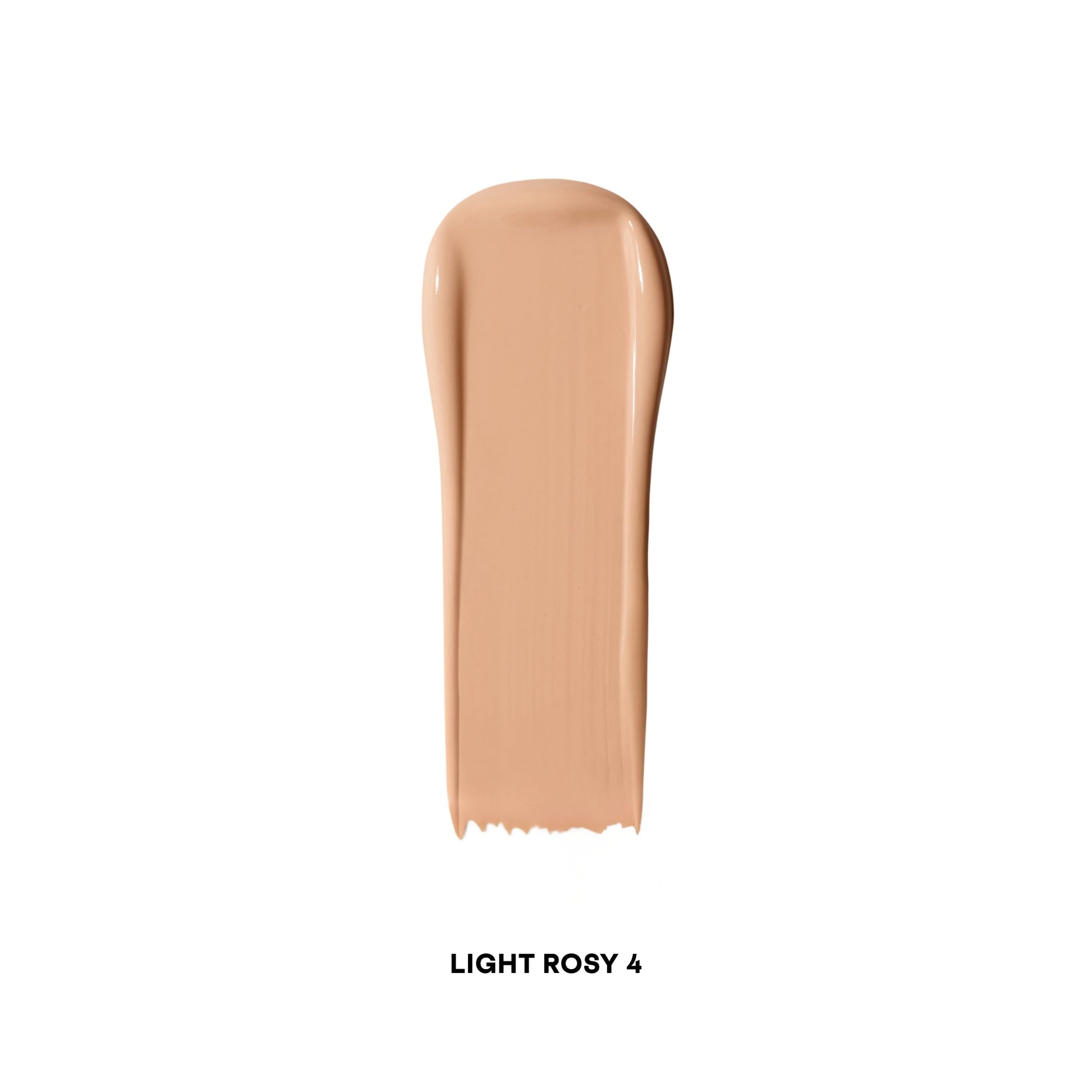 Creamy concealer swatch in light rosy shade with smooth, dewy finish on white background.