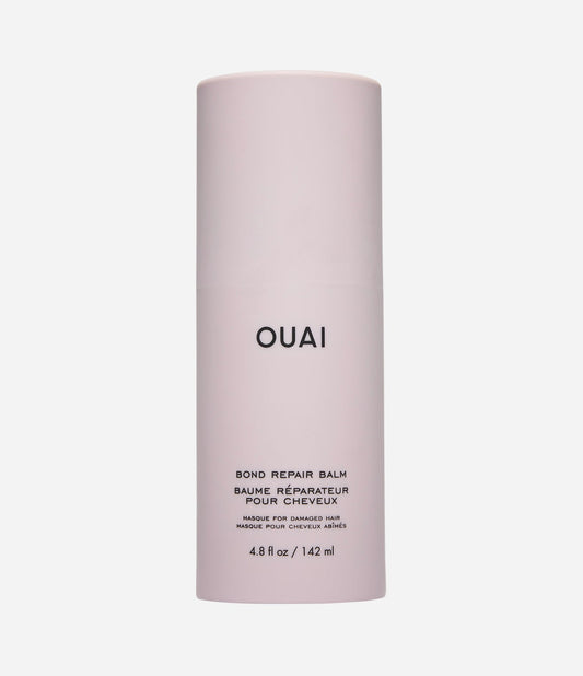 Ouai hair balm container on a white background