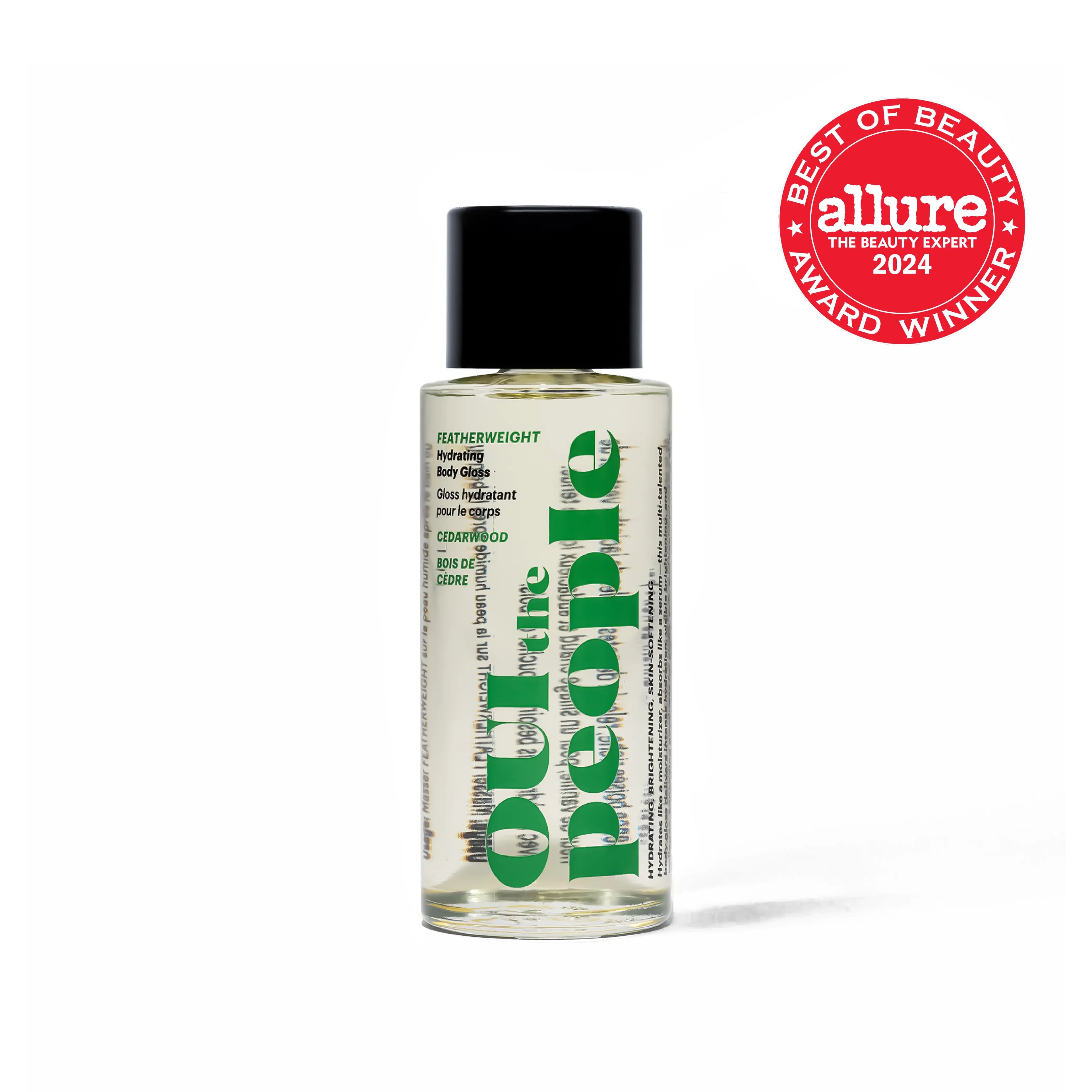 Luxurious clear body gloss oil bottle with black cap, green text, and Allure award badge