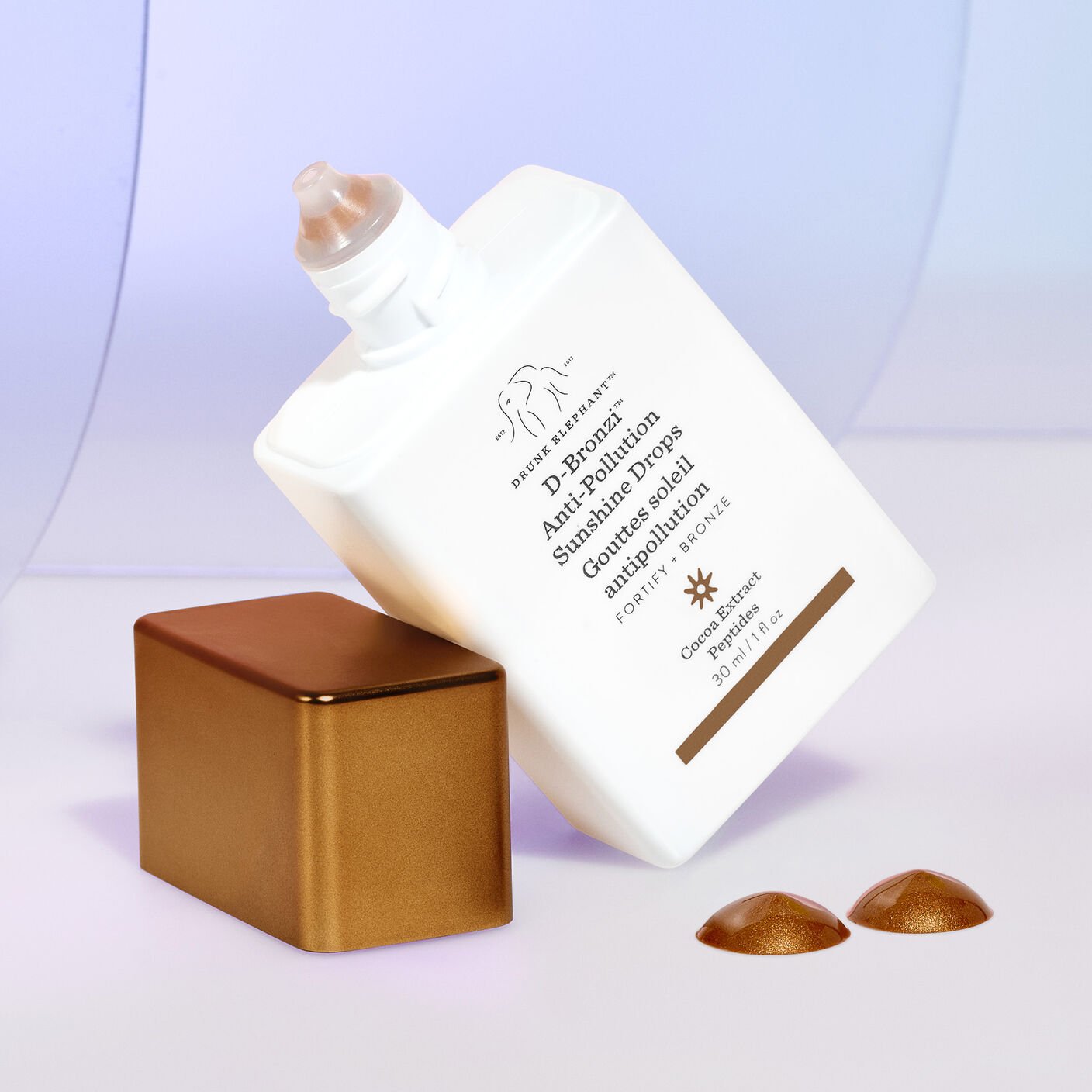 Drunk Elephant D-Bronzi Anti-Pollution Sunshine Drops bottle with bronze cap and drops