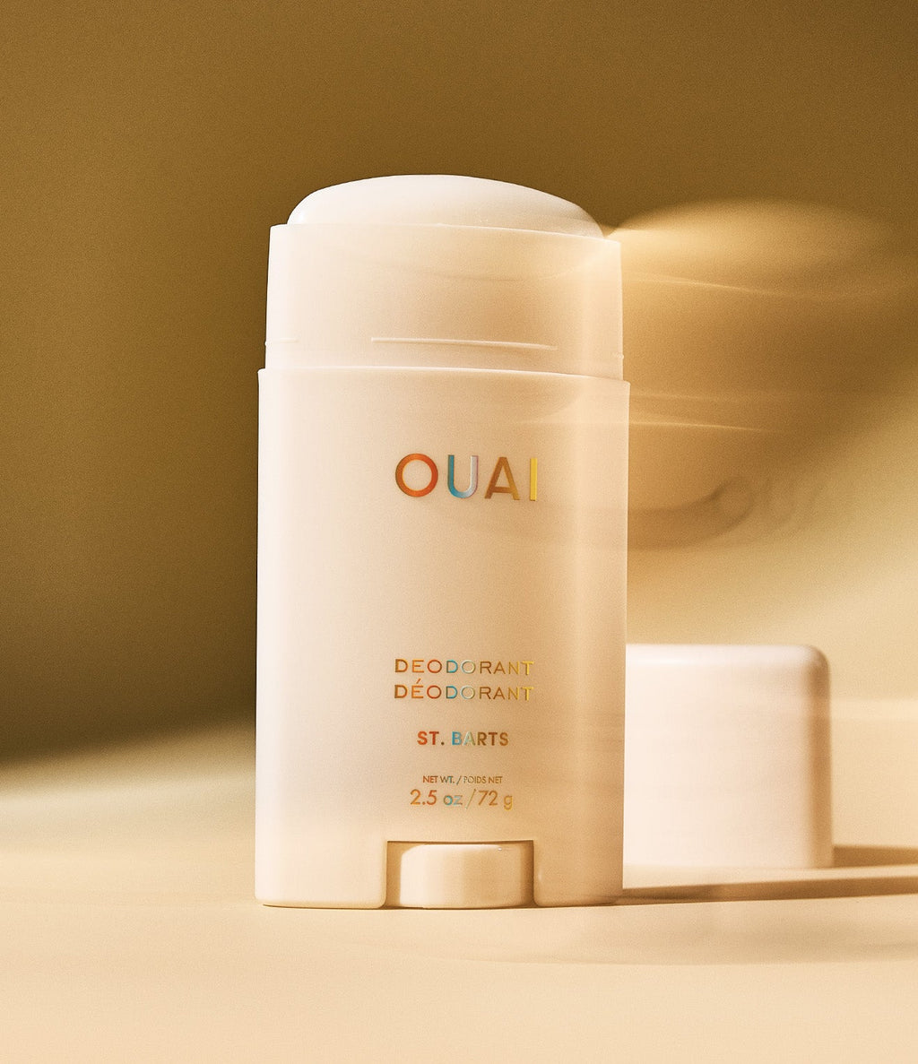 OUAI deodorant stick on a beige background