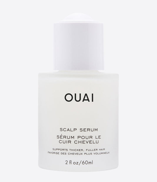 Minimalist frosted glass bottle of scalp serum with a smooth, silken liquid texture.