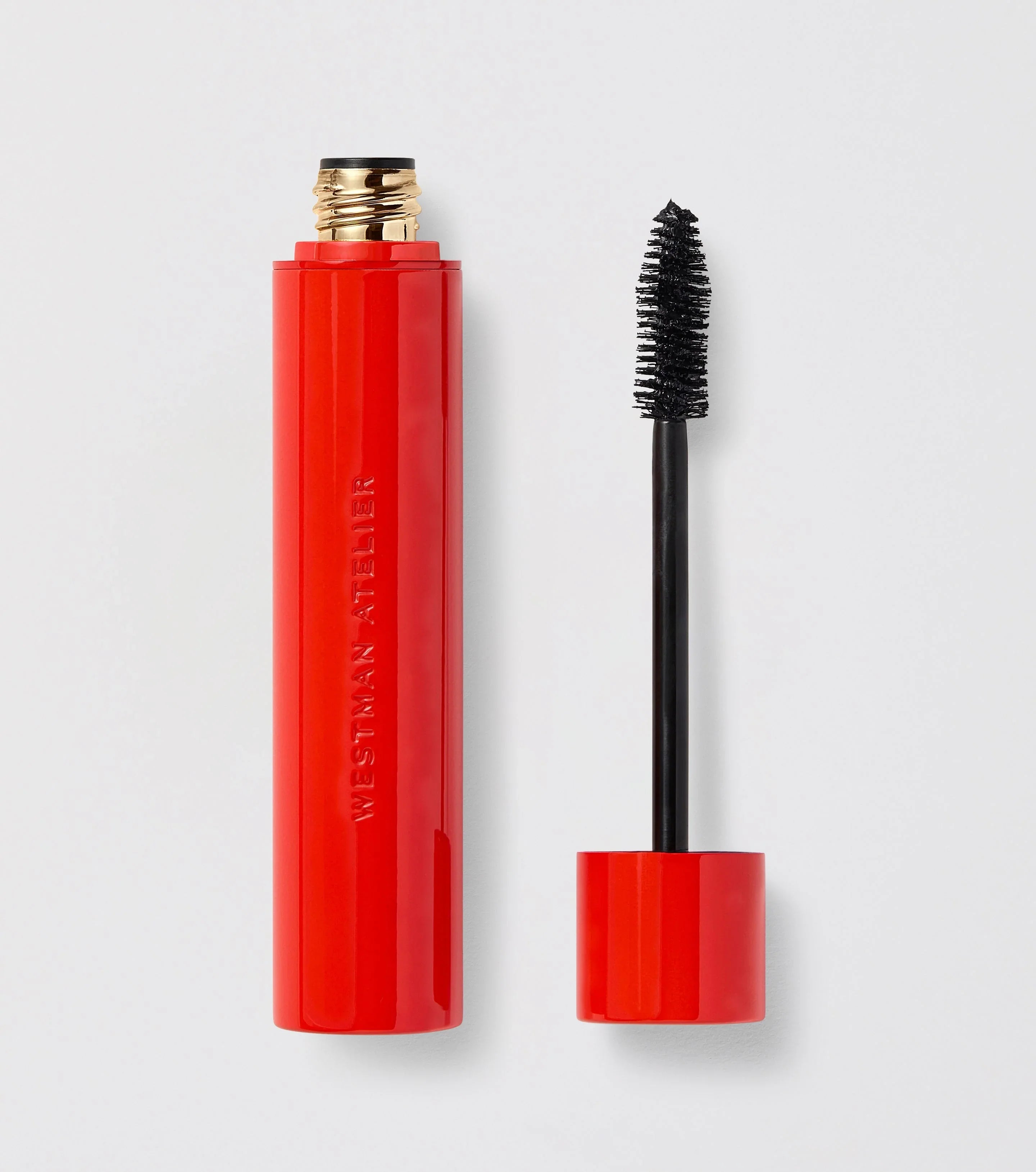 Luxurious black mascara in a sleek glossy red tube, ideal for volumizing lashes, Wylde Grey