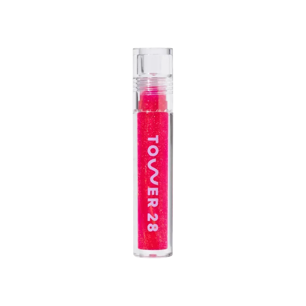 A model wearing the Tower 28 Beauty ShineOn Lip Jelly in the shade Iced XOXO. [Iced XOXO]