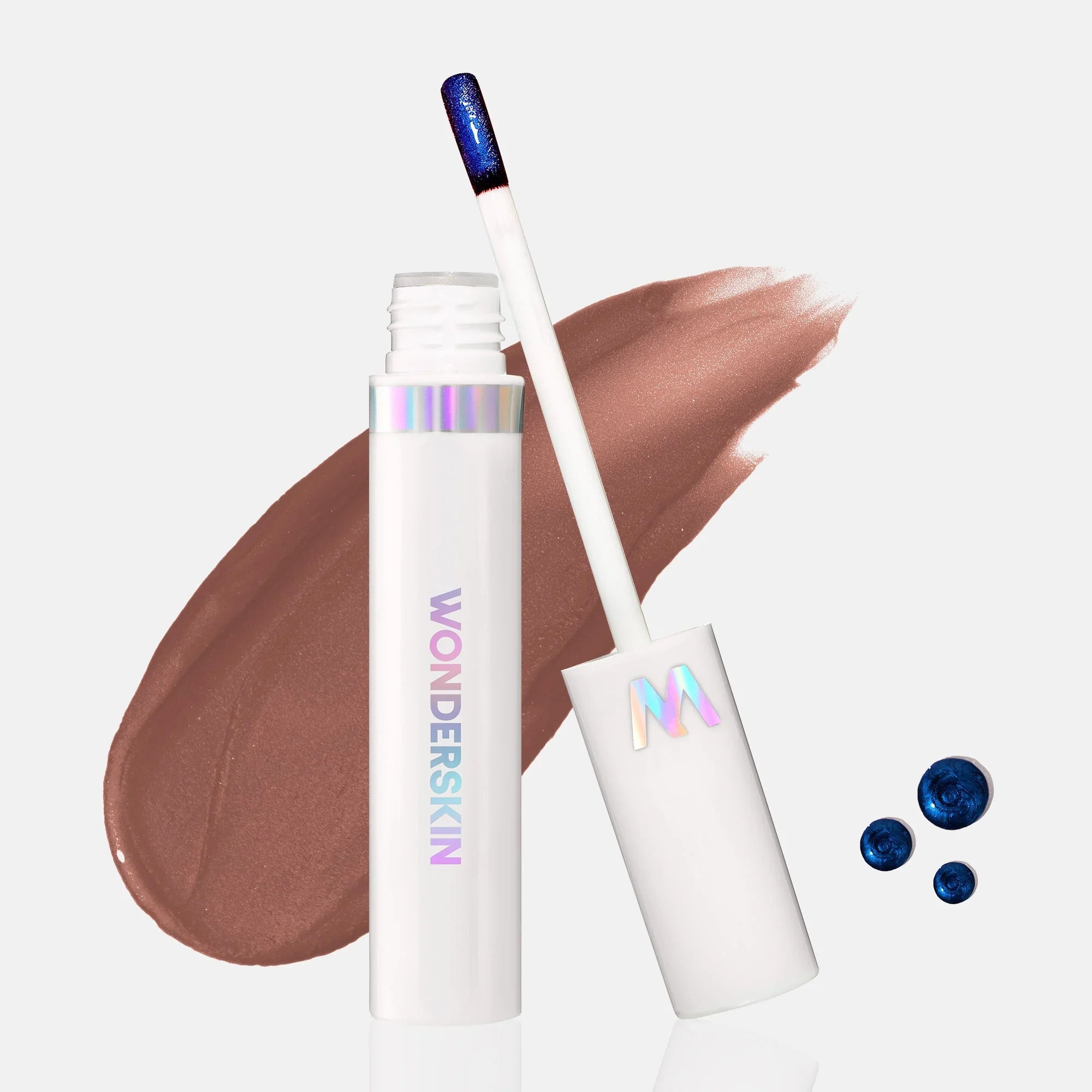 Wonderskin lip color in taupe nude with blue shimmer, creamy texture, luxury packaging