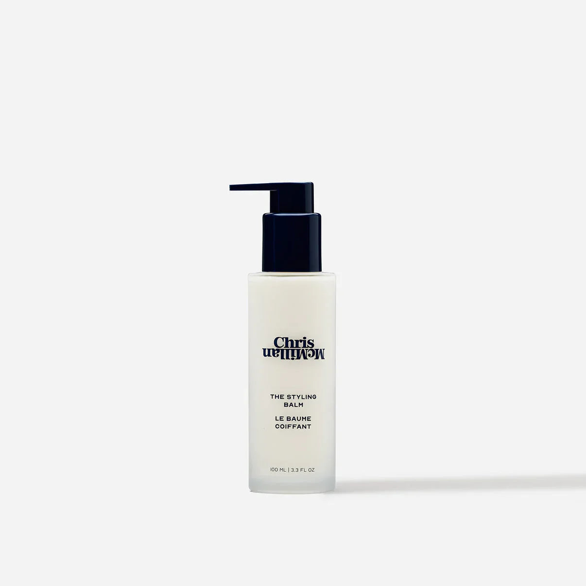 Chris McMillan The Styling Balm in sleek white bottle with black pump, luxury haircare at Wylde Grey