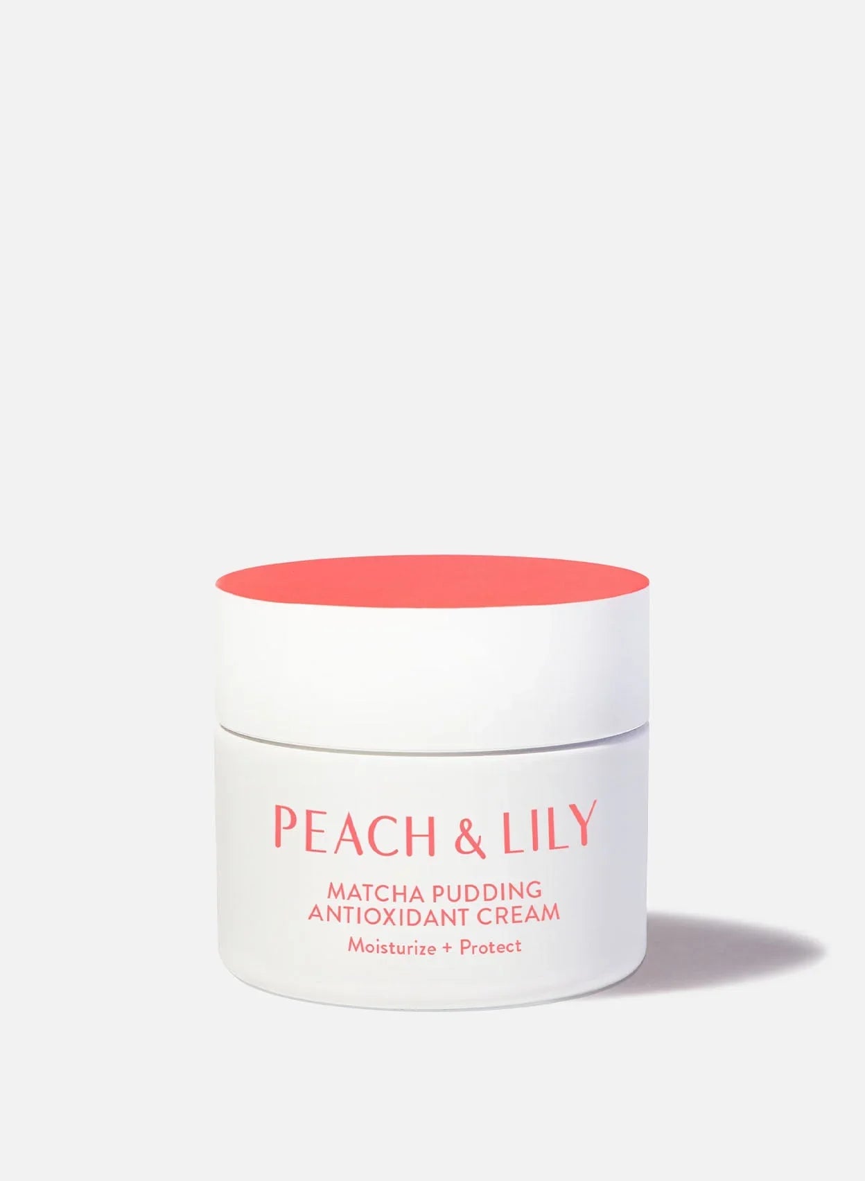 Peach & Lily Matcha Pudding Antioxidant Cream in a white jar with coral lid, luxury skincare