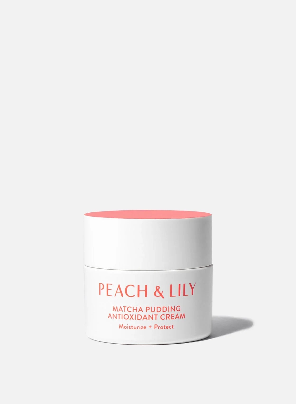 Peach & Lily Matcha Pudding Antioxidant Cream in a sleek white and peach jar on a light background