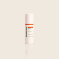 BeautyStat Universal C Skin Refiner serum in sleek white bottle with orange label, on beige background