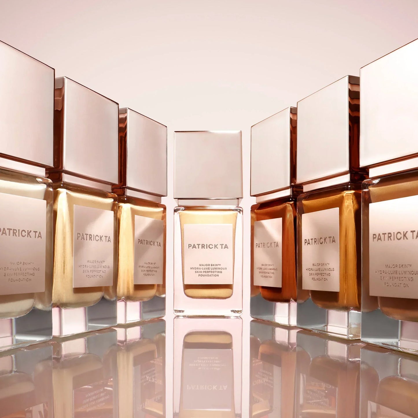 Patrick Ta Luxe Foundation bottles in a gradient of creamy to deep shades with luminous, dewy finish