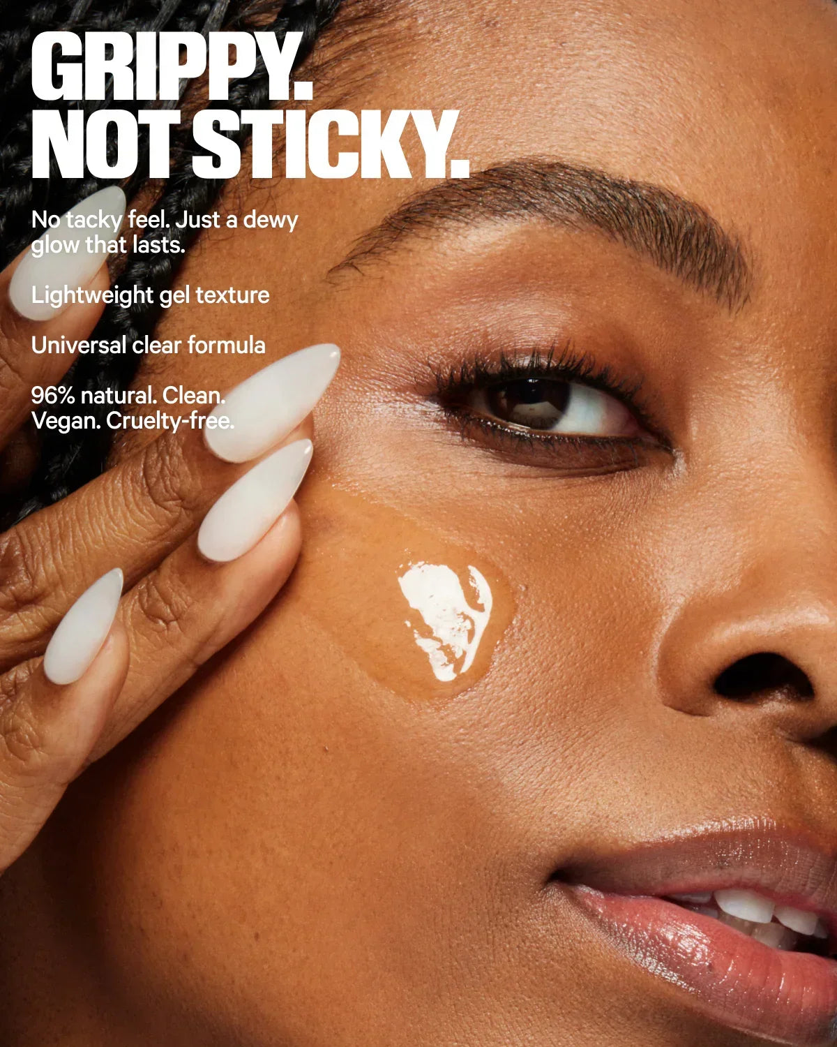 Model applying clear gel skincare with dewy glow on cheek, promoting Wylde Grey beauty.
