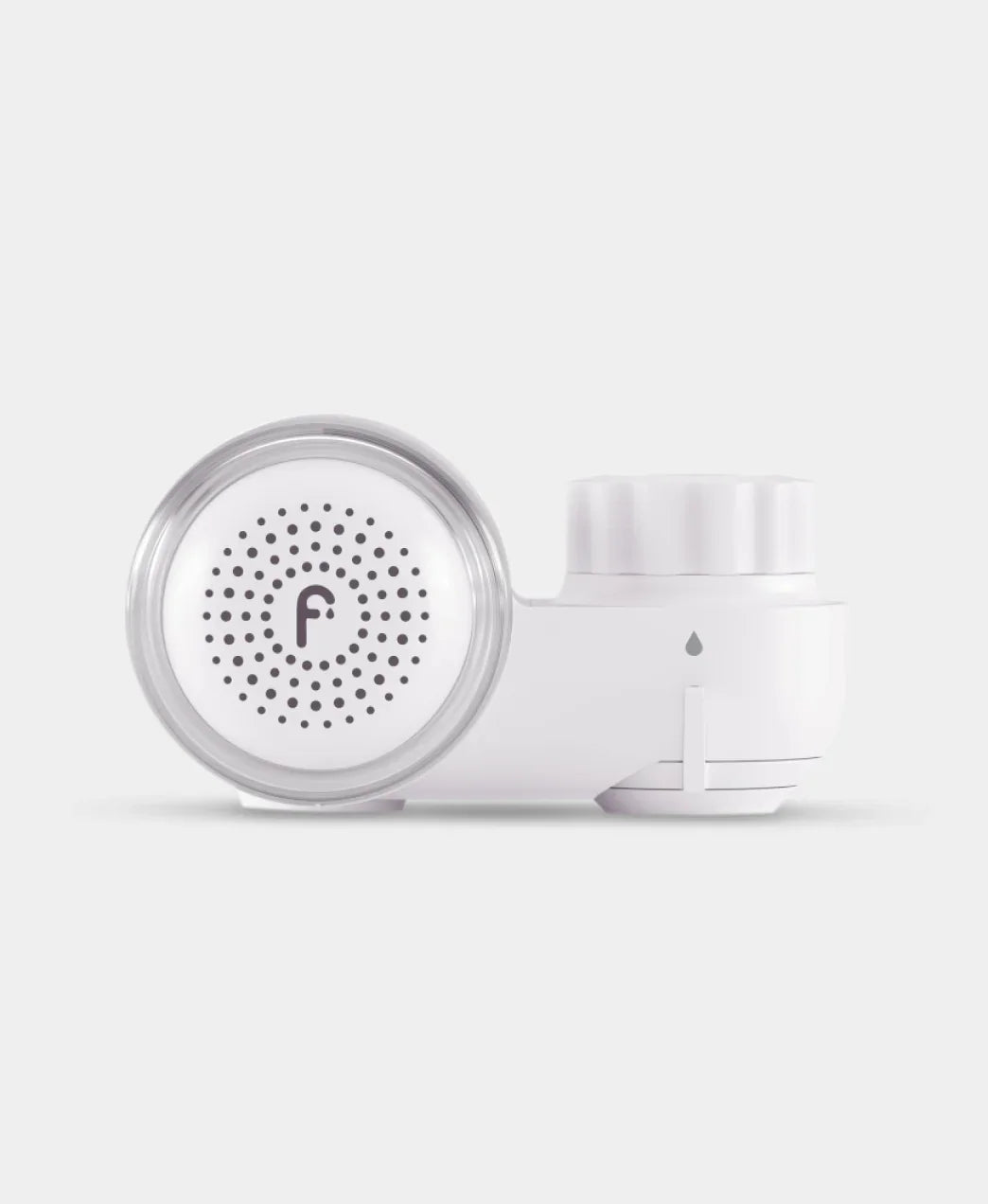 Sleek white beauty device with circular vented face on Wylde Grey, ideal for skincare routines.