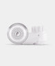 Sleek white beauty device with circular vented face on Wylde Grey, ideal for skincare routines.
