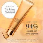 KORA Organics Turmeric Brightening Exfoliating Mask with golden tube and sleek metallic cap on peach background, highlighting glowing skincare results.