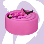 Kourtney laying on top of an oversized pink gummy with lemme debloat shape in the background