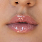 A model wearing the Tower 28 Beauty ShineOn Lip Jelly in the shade Pistachio on her lips. [Pistachio]