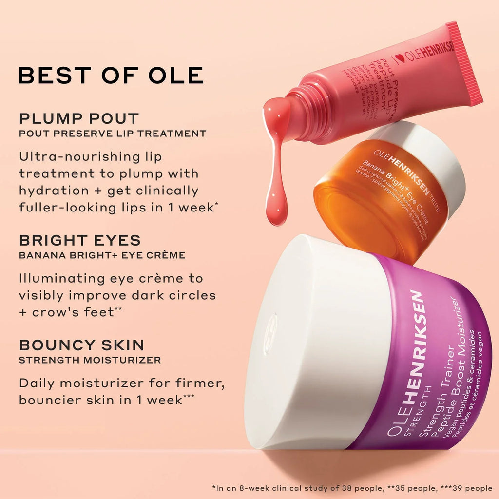 Ole Henriksen skincare bestsellers with pink lip treatment, orange eye crème, and purple moisturizer jar on a blush background.