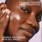 Woman applying creamy peptide moisturizer for firmer, glowing skin, Wylde Grey skincare