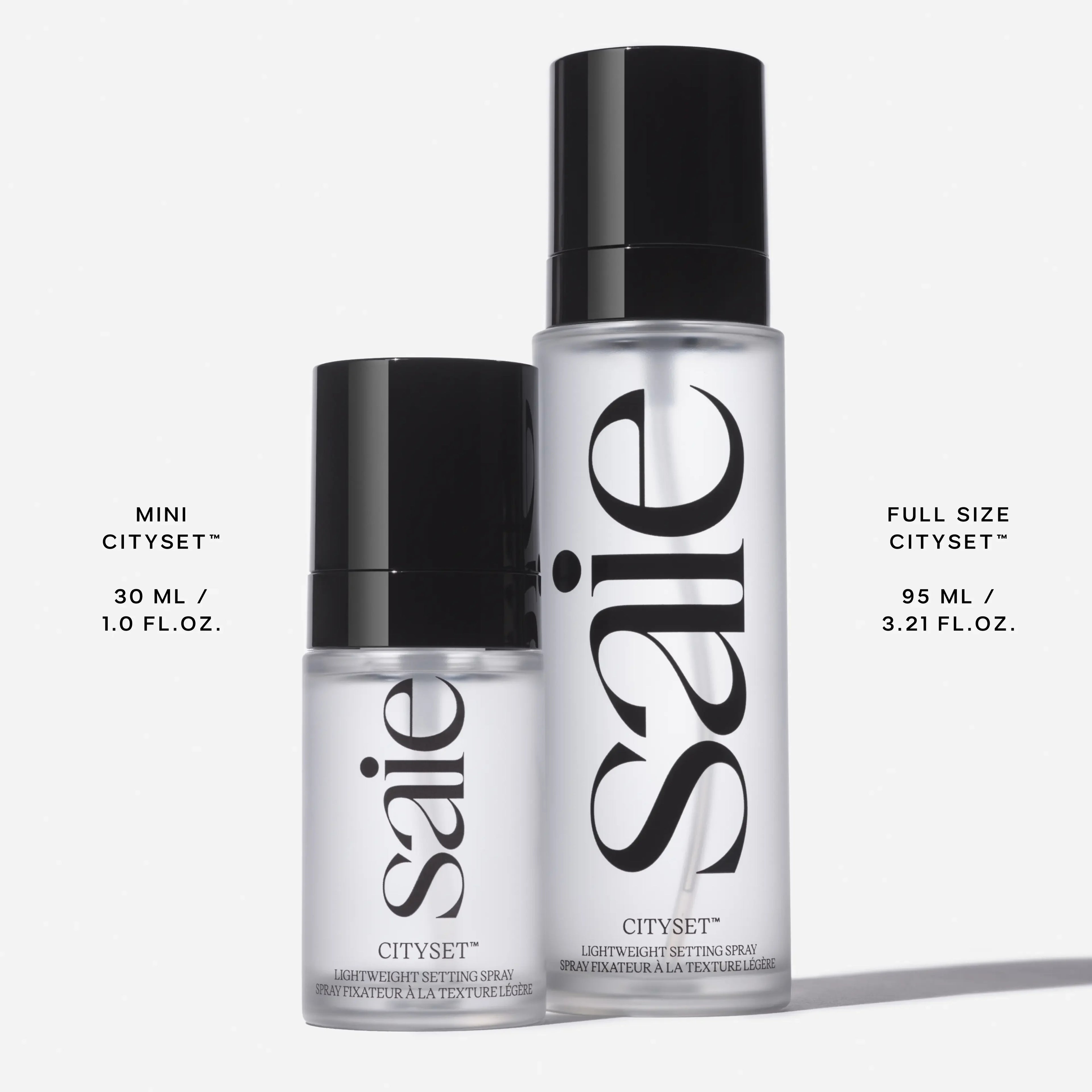 Saie CitySet Mini and Full Size setting spray in sleek frosted bottles with glossy black caps