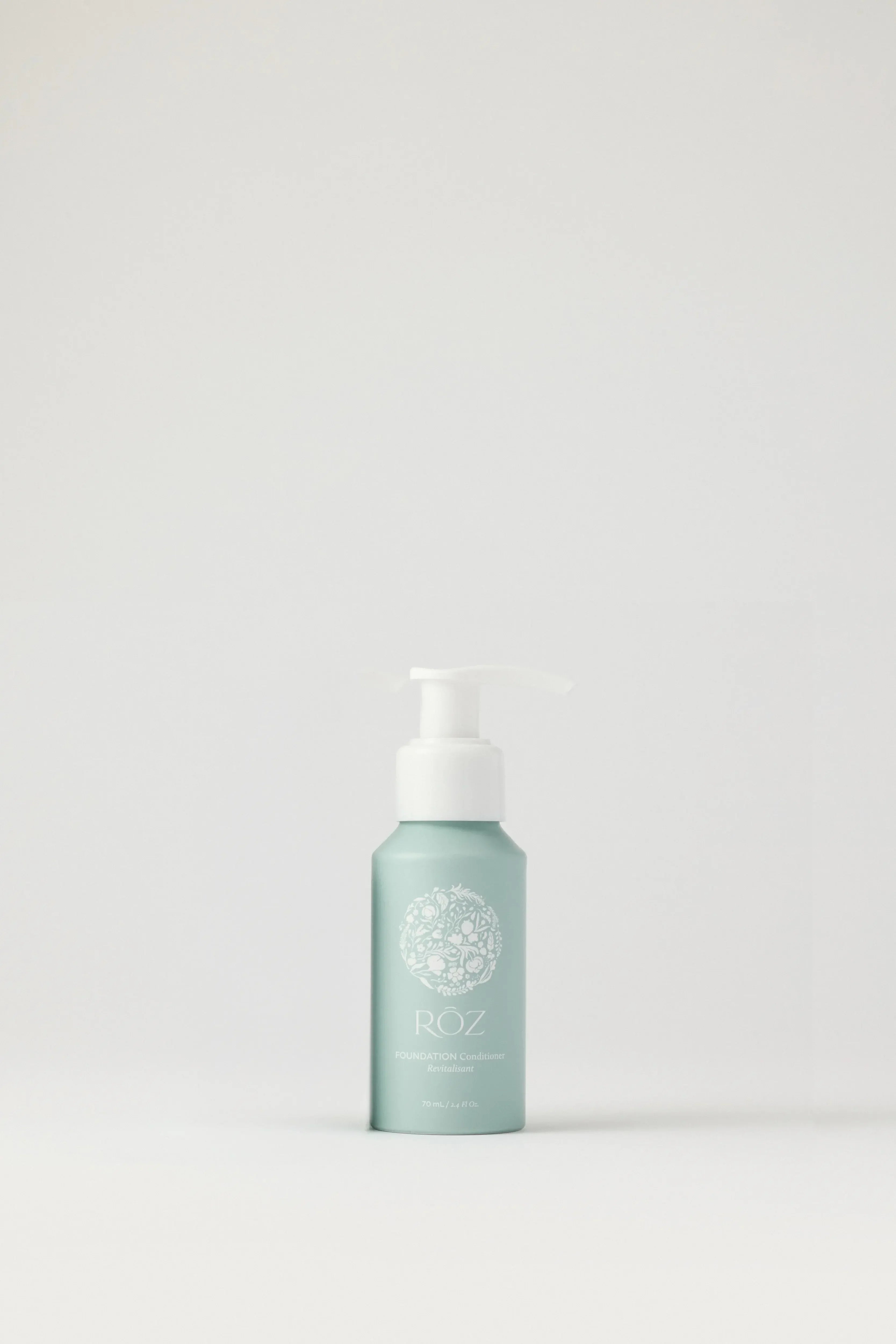 Luxurious mint green ROZ Foundation Conditioner mini travel bottle with soft matte finish