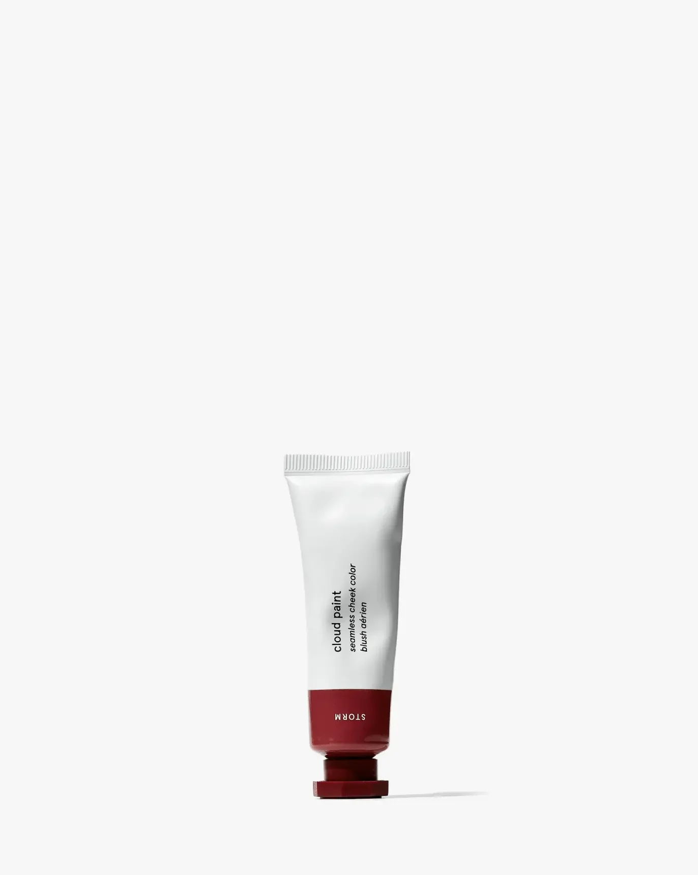 Creamy gel blush tube in a deep berry shade with sleek, minimal packaging on white background.