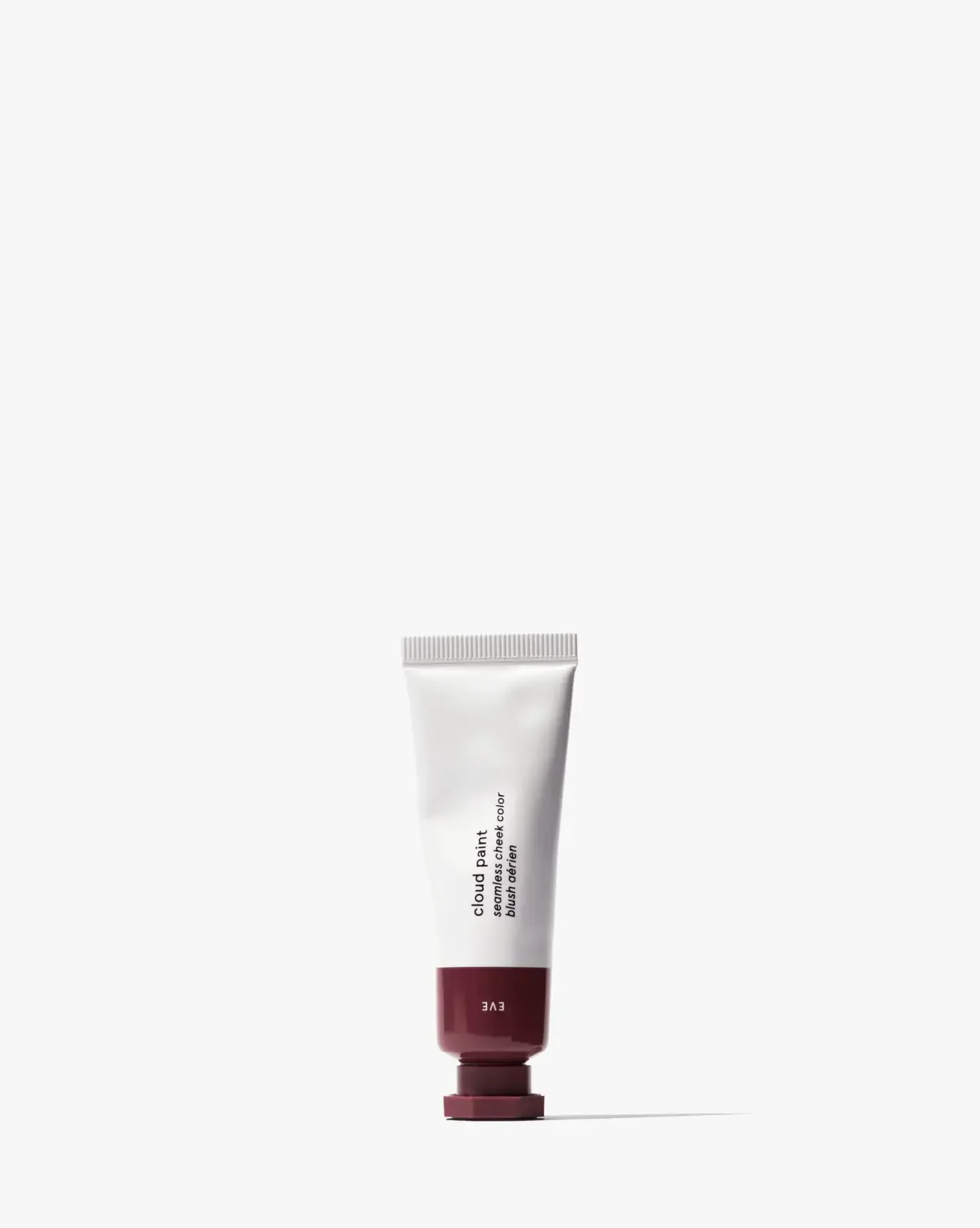 Cream blush tube with a soft matte finish and deep berry cap on a white background