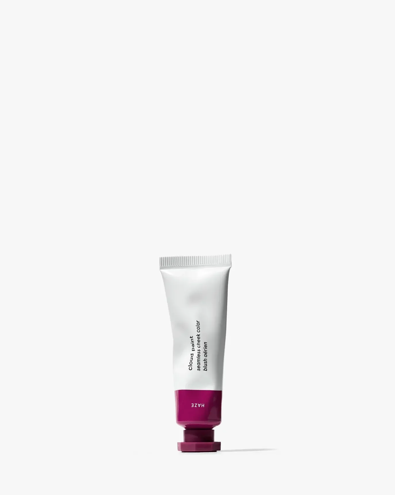 Creamy mauve tube of Cloud Paint blush with a sleek, minimalist design on white background.