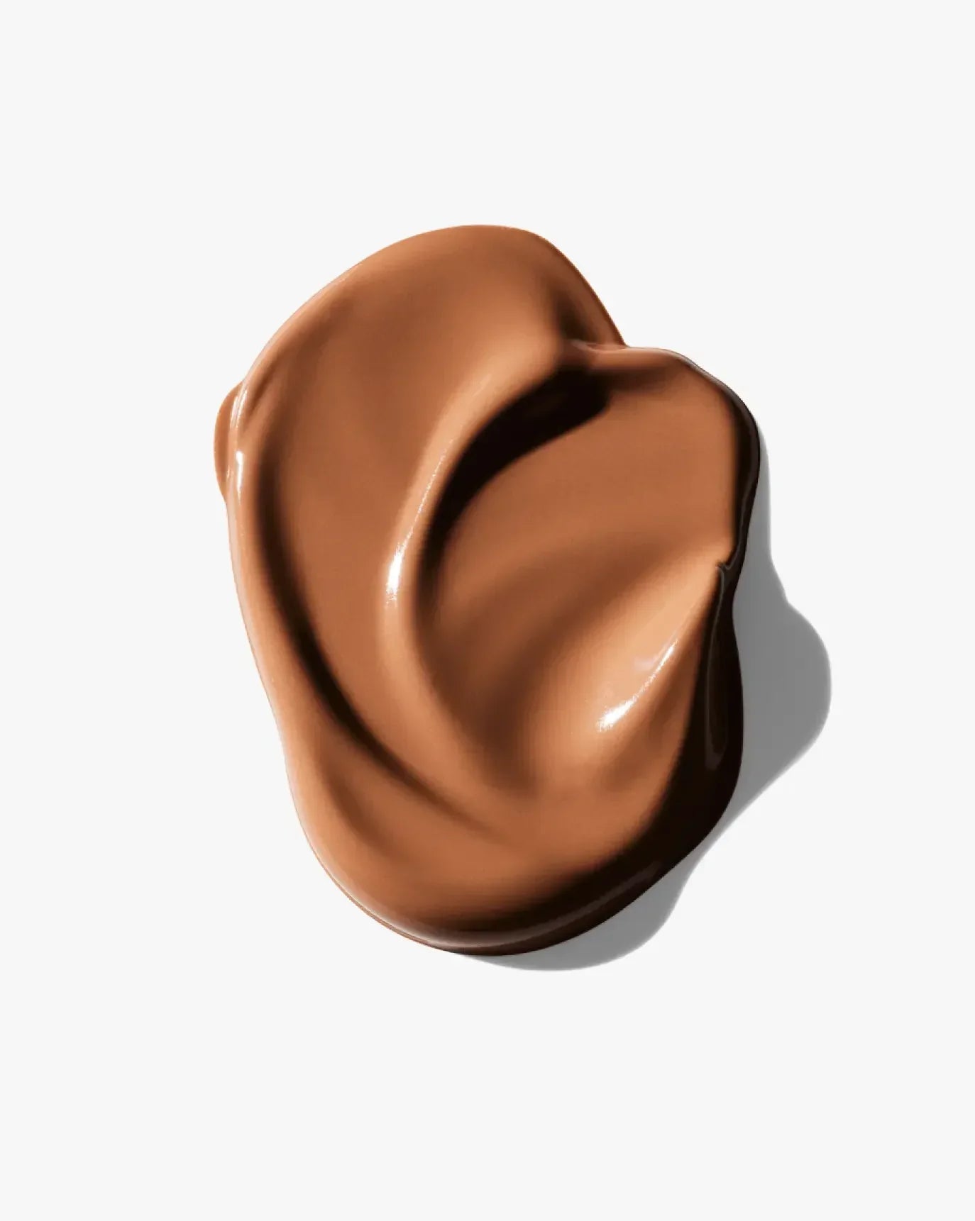 Rich brown creamy blush swatch with dewy finish on a white background.