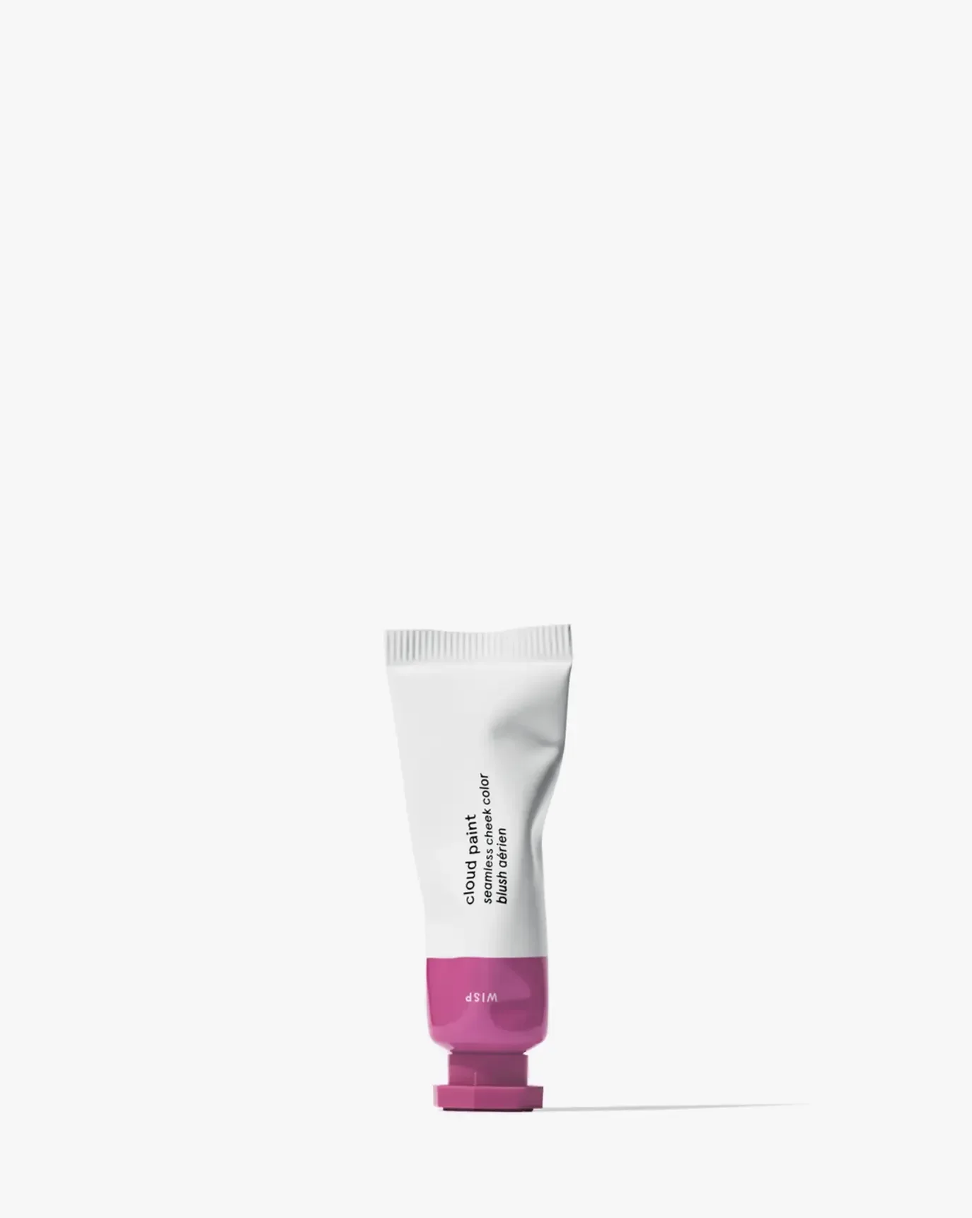 Soft pink cream blush in a sleek tube, featuring a dewy finish and creamy texture